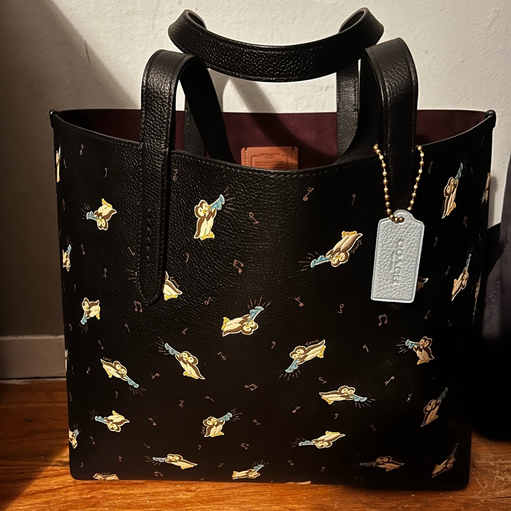 coach tote never used. The design on the bag is owls. no stains, no damage.